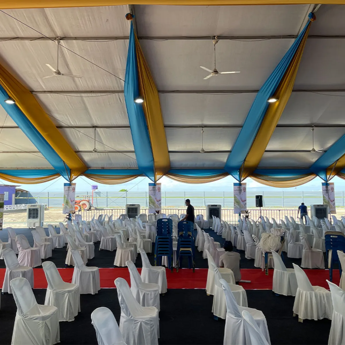 Draped marquee interior configured with banquet seating