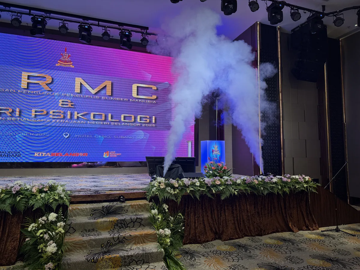 Stage with haze jets, flower garlands and an LED backdrop
